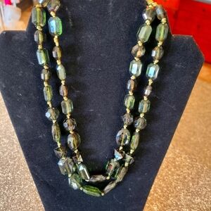 Green beaded double strand necklace.